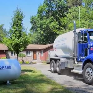 propane delivery truck at residential house